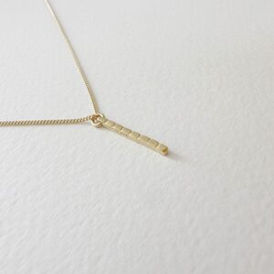 camu stick necklace gold