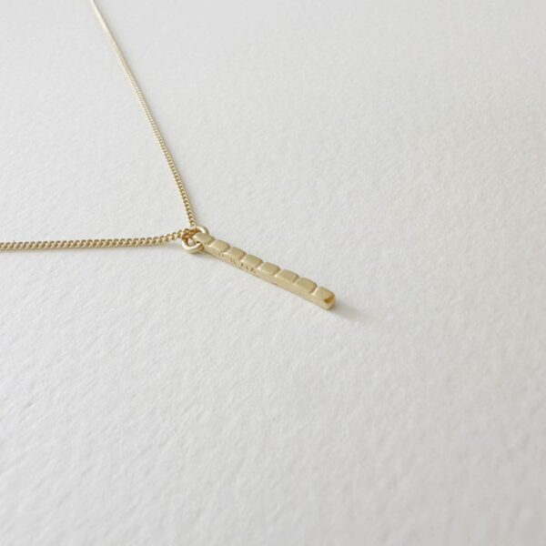 camu stick necklace gold