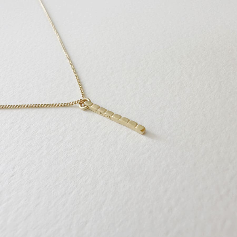 camu stick necklace gold